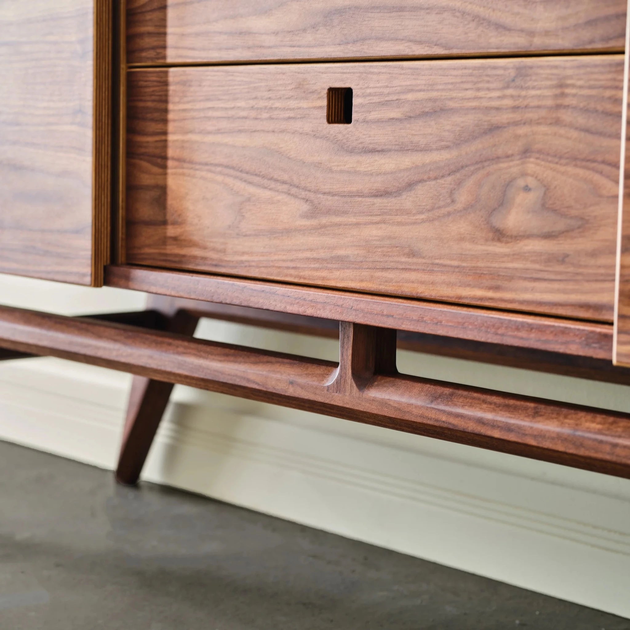 Walnut Media Console No. 2 base detail, angled legs, stretcher, drawer with square recessed pull