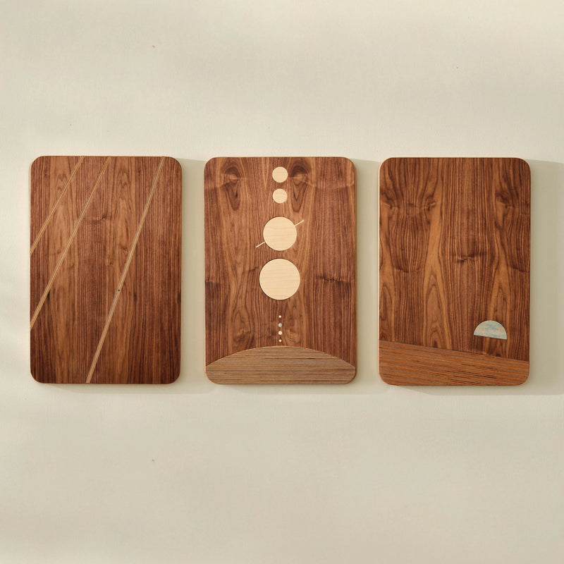 The Dot Series walnut wall art triptych with maple circle and stripe inlays