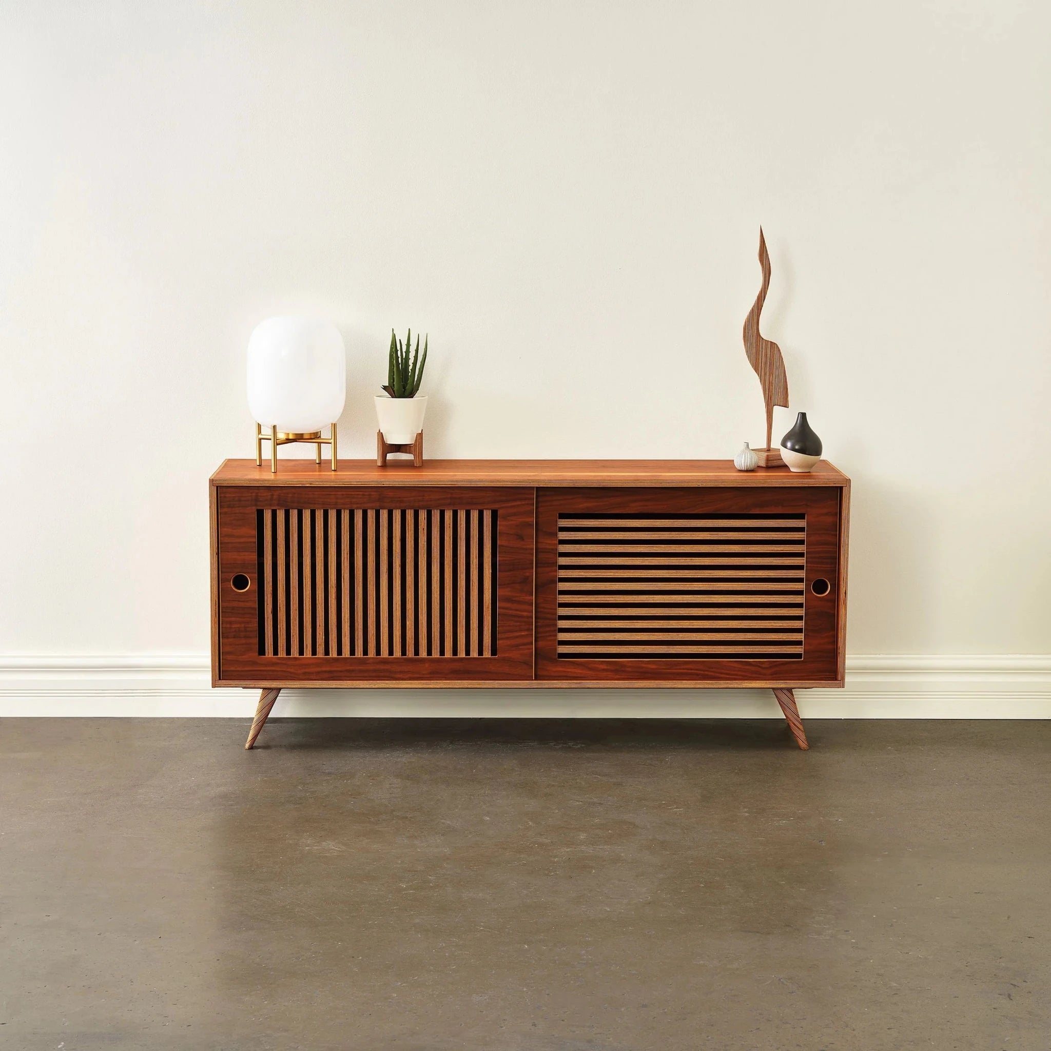 Walnut Media Console No. 1 styled front, closed slatted doors, globe lamp, aloe, bird sculpture