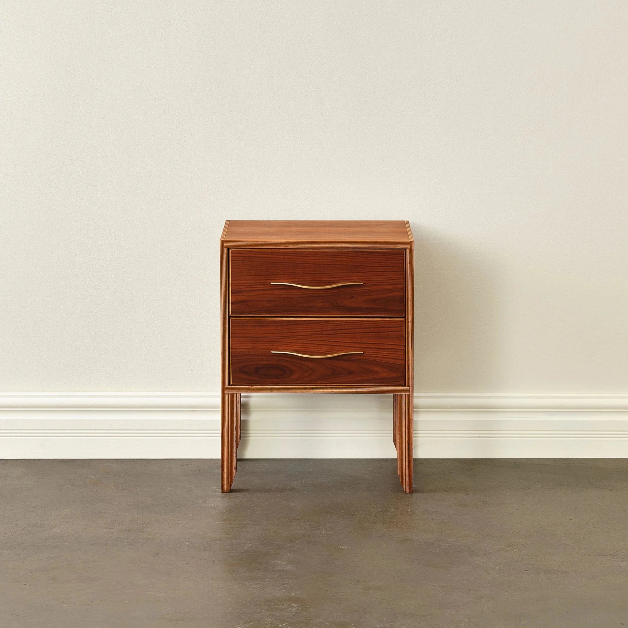 Walnut nightstand, two drawers with brass pulls, tapered legs, front view