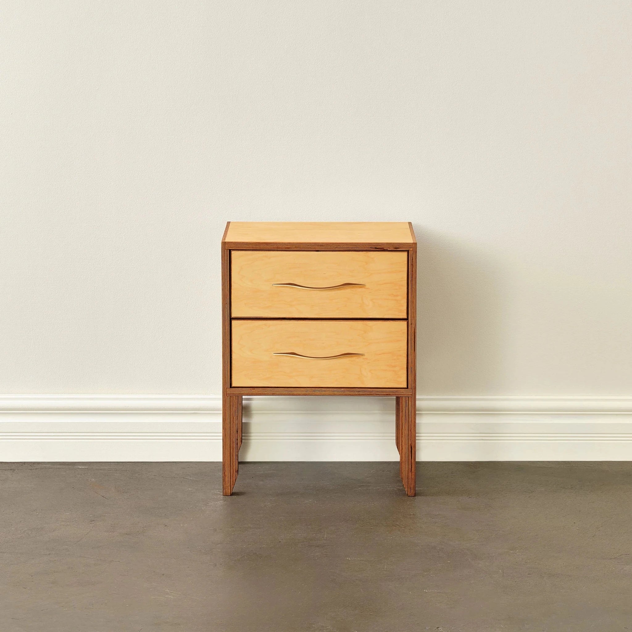 Maple nightstand with two drawers, carved pulls, tapered legs, front view