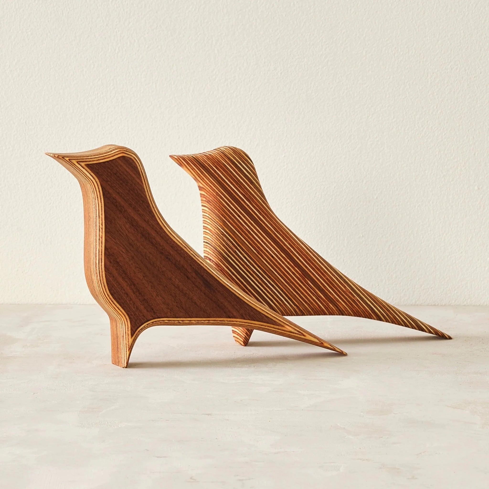 Pair of Robin bird sculptures in walnut and layered Baltic birch plywood, plain neutral background