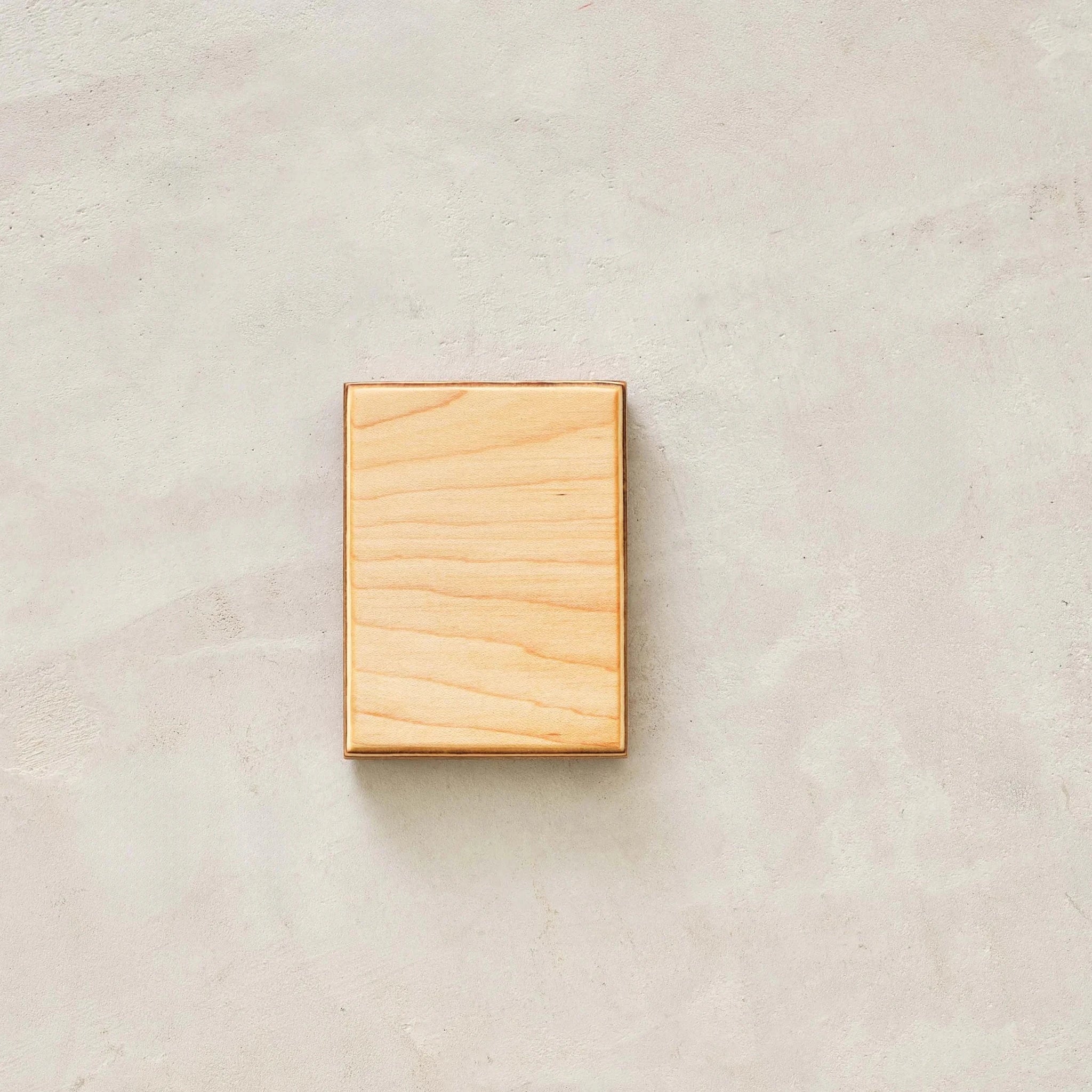 Maple wood sample block, pale grain with layered birch plywood edge