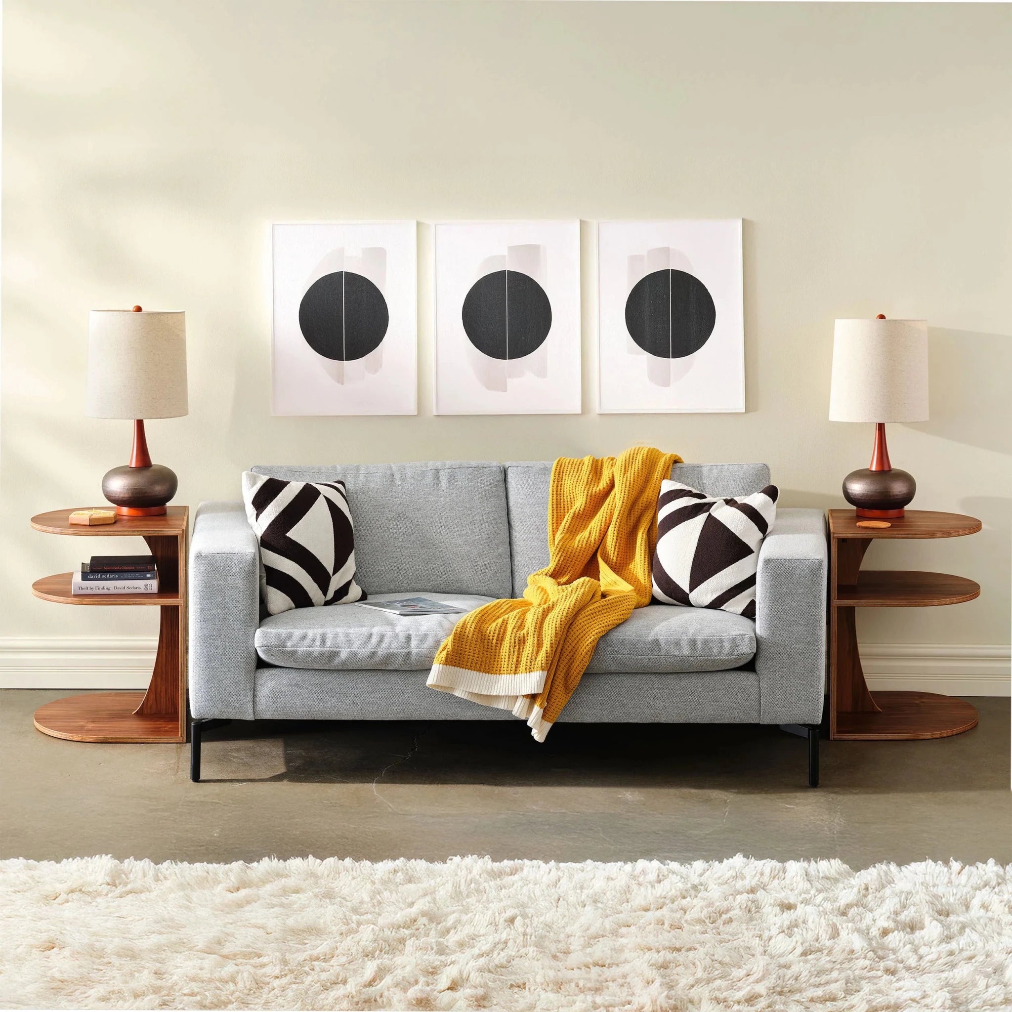 Living room with two walnut End Tables No. 2 flanking gray sofa, lamps, art