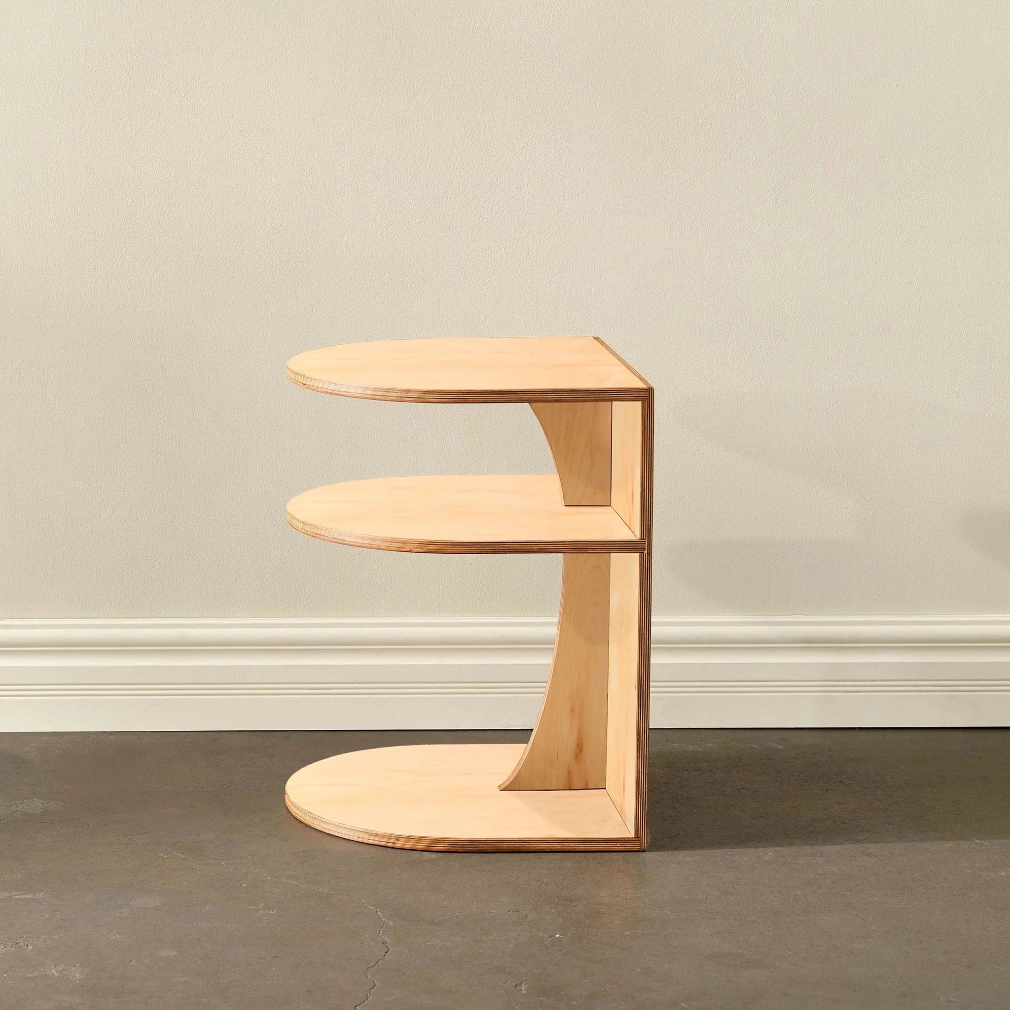 Maple End Table No. 2 side view, blond birch tiered shelves, empty, concrete floor