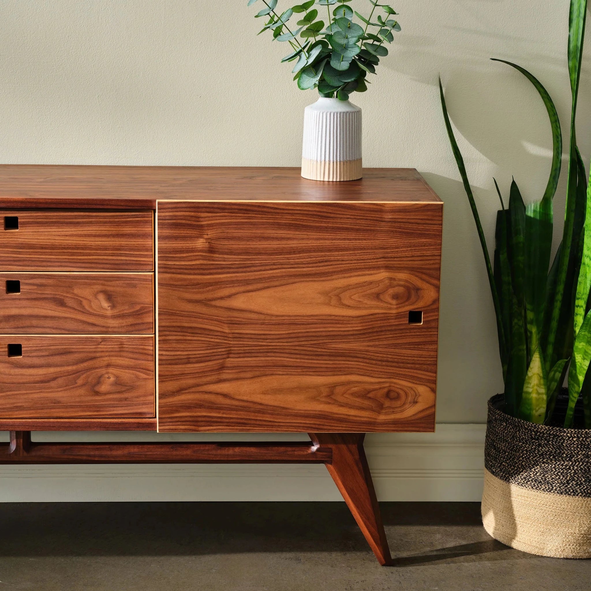 Walnut Media Console No. 2 right side detail, fluted vase with eucalyptus, potted snake plant
