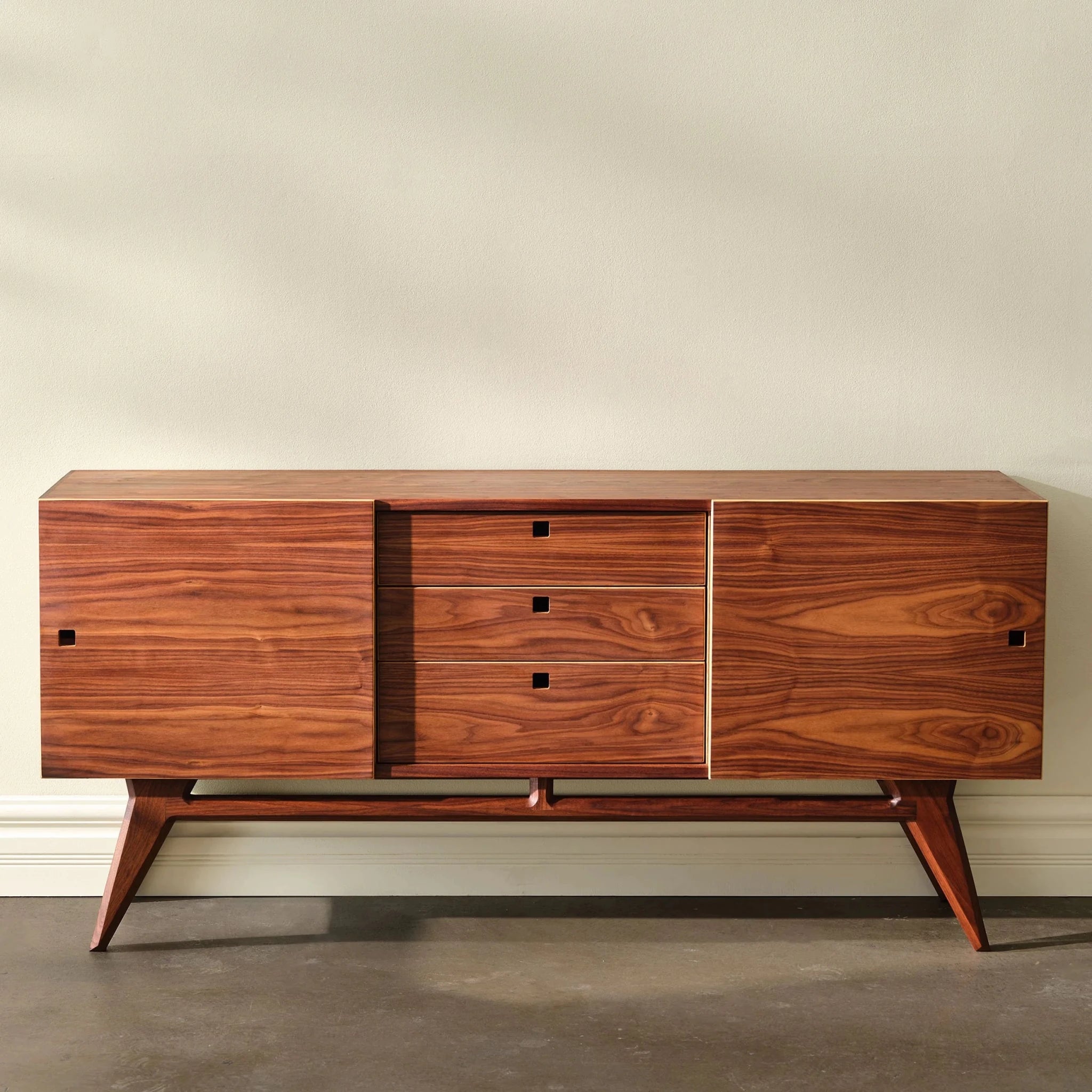 Walnut Media Console No. 2, plain-wall front view, three center drawers, sliding doors closed