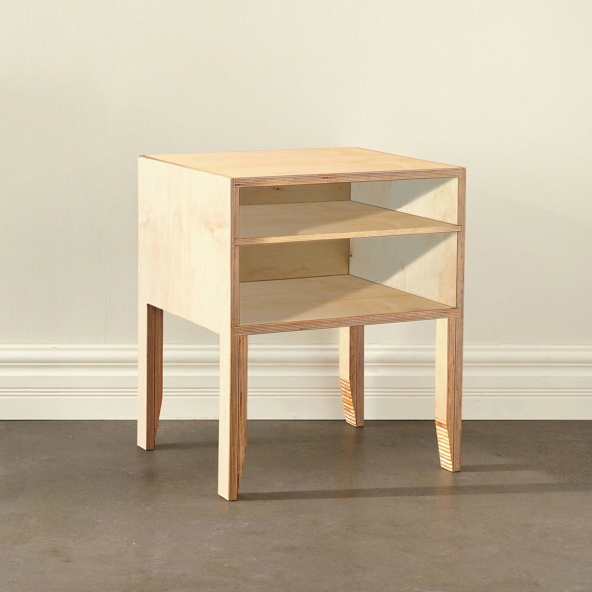 Light birch open-shelf nightstand, two open shelves, angled side view