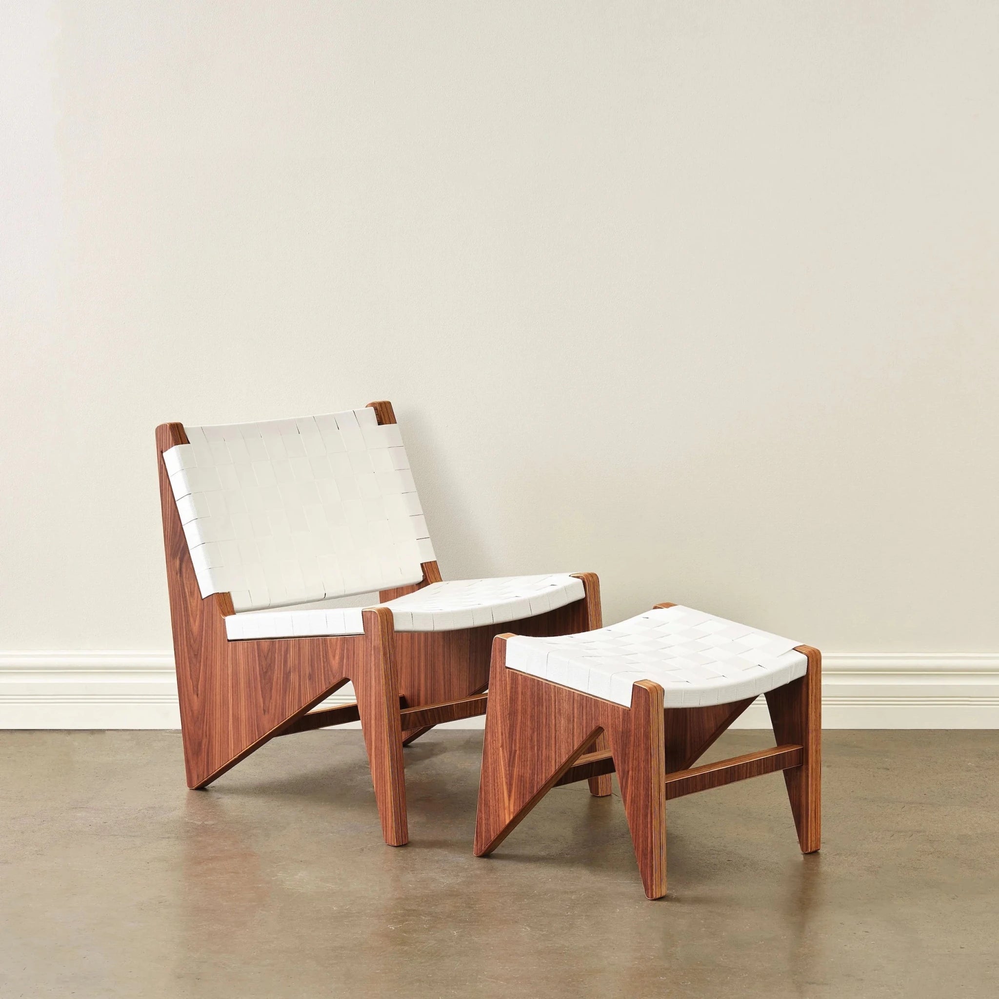 Walnut lounge chair and matching ottoman with white woven strap seating