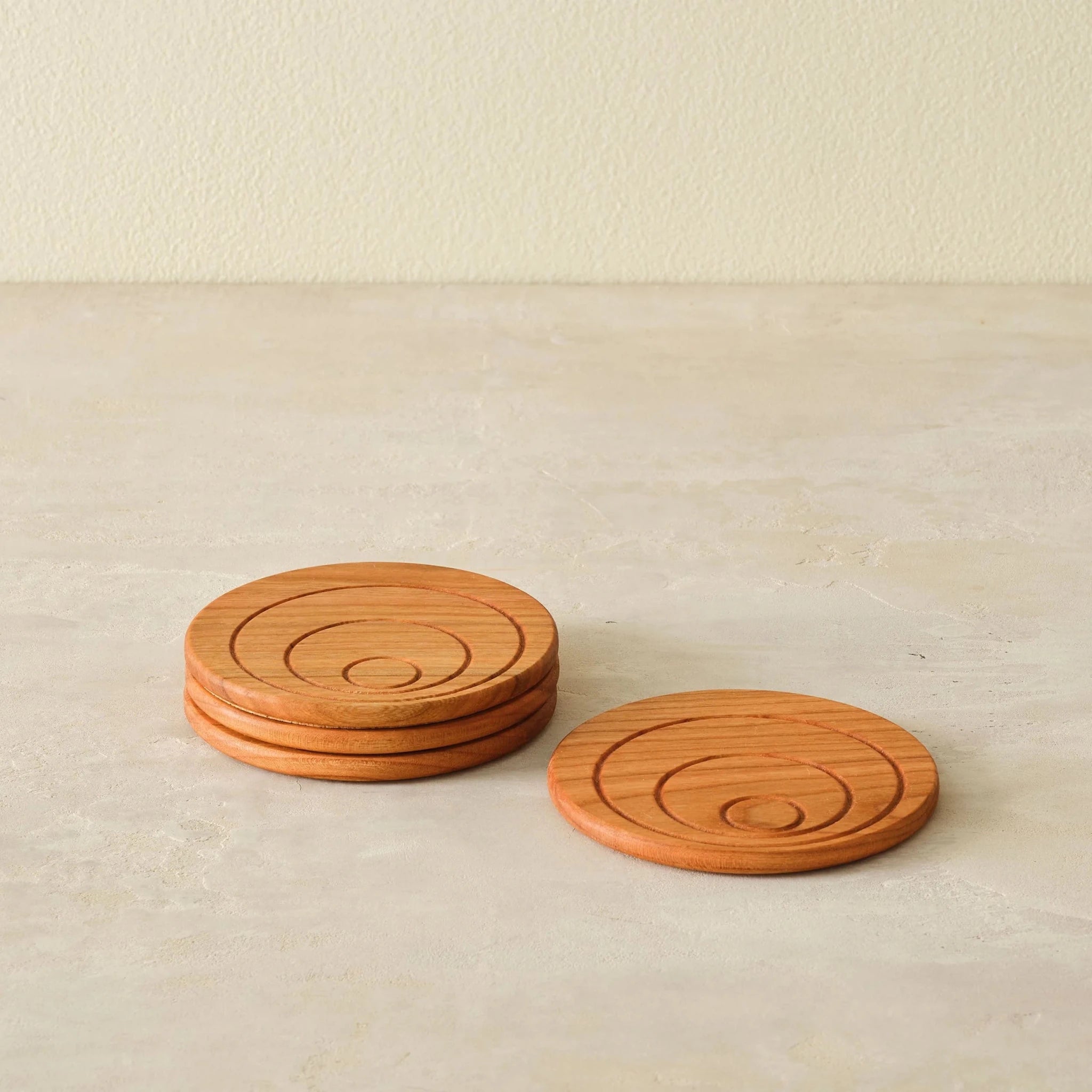 Cherry coaster set, front angle, one coaster upright beside short stack