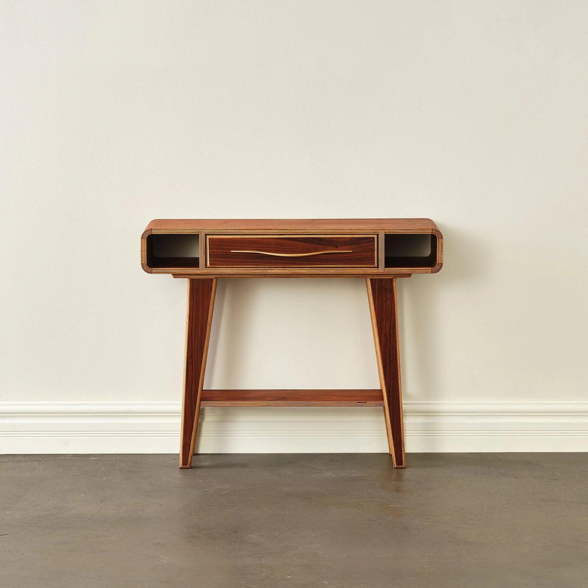 Walnut entry table front view, closed drawer with brass pull, open side cubbies, empty