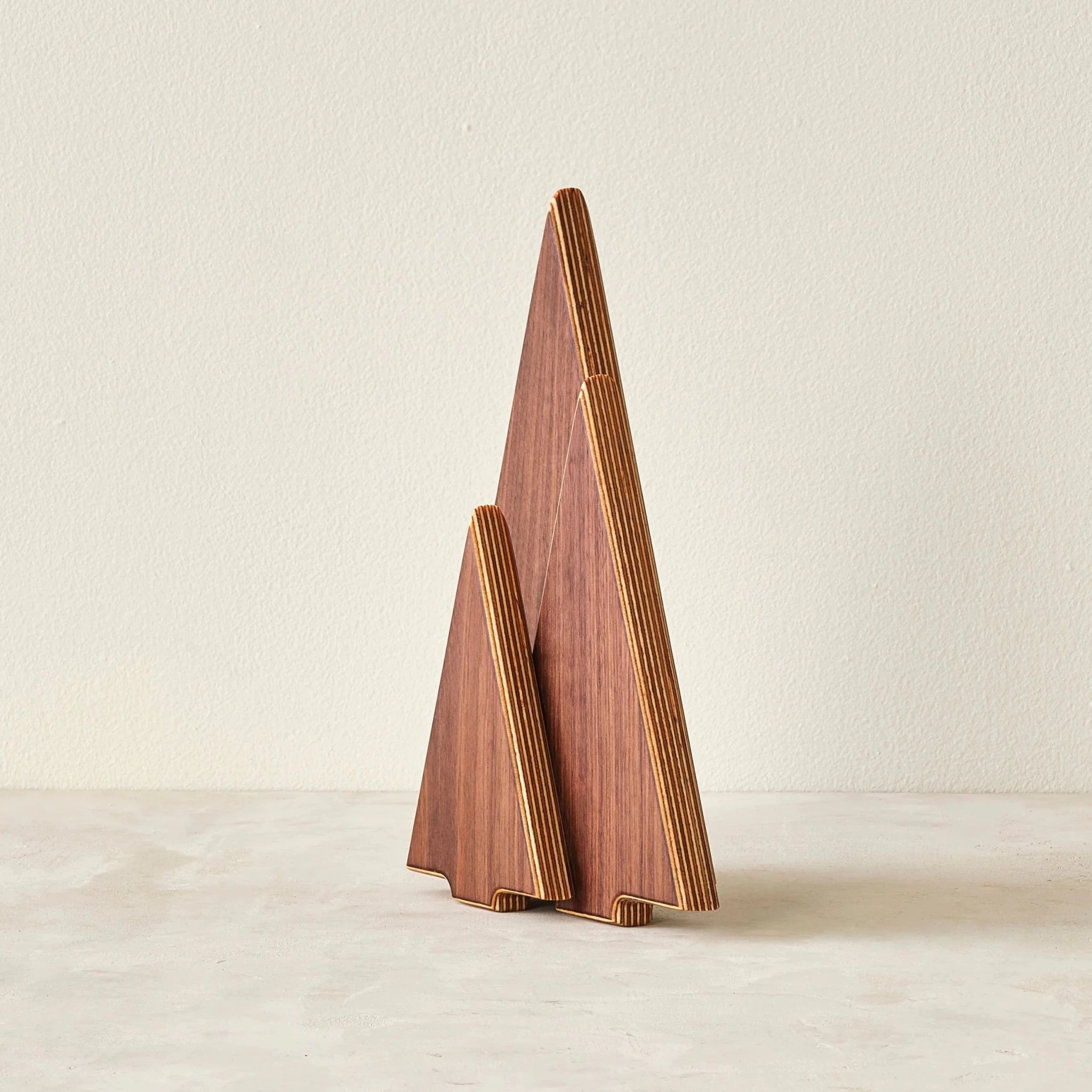 Walnut tree sculptures, angled view showing layered birch plywood edges