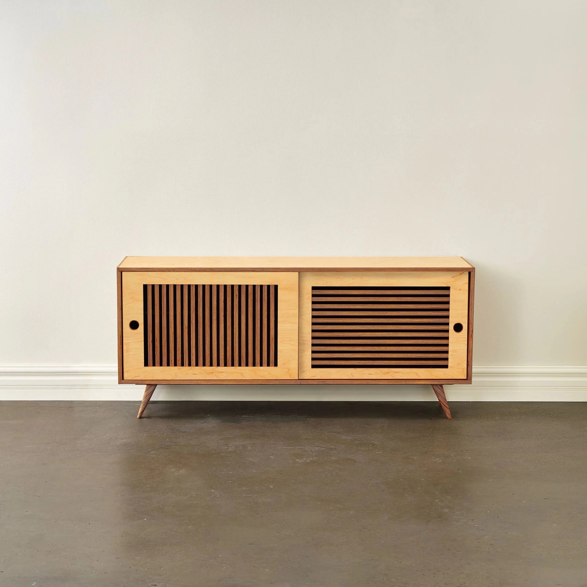 Blonde maple Media Console No. 1 front, slatted sliding doors, round pulls, tapered legs